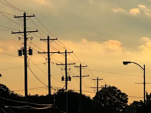 Urban veins catch the last light of a golden sky.